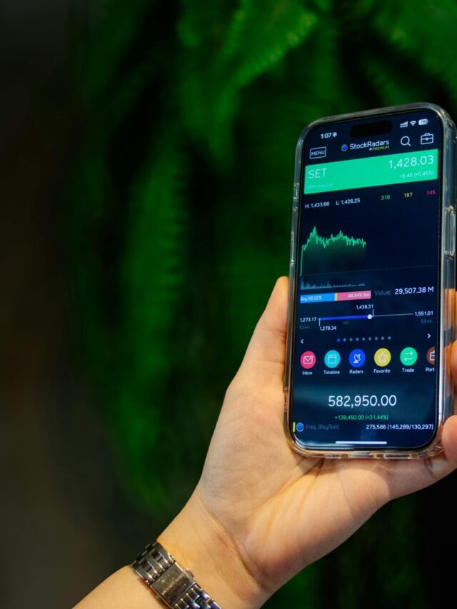 Close-up of a smartphone displaying a stock trading app with market data on-screen.